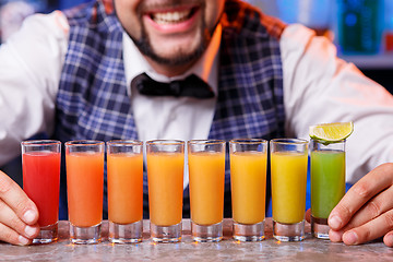 Image showing Barman at work, preparing cocktails.