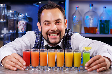 Image showing Barman at work, preparing cocktails.