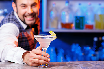 Image showing Barman at work, preparing cocktails.