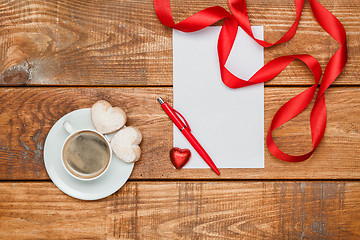 Image showing The blank sheet of paper and pen with small hearts  