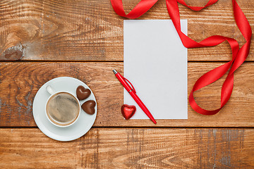 Image showing The blank sheet of paper and pen with small hearts  