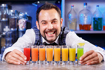 Image showing Barman at work, preparing cocktails.