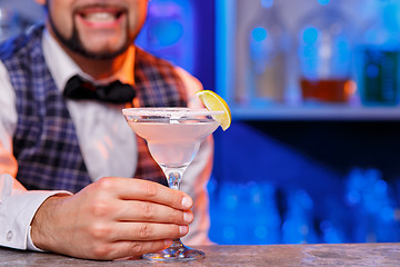 Image showing Barman at work, preparing cocktails.