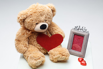 Image showing Teddy Bears couple with red heart. Valentines Day concept.