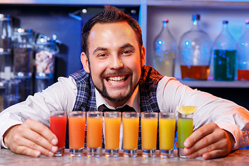 Image showing Barman at work, preparing cocktails.