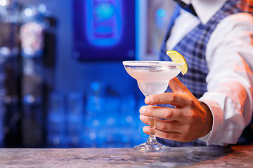 Image showing Barman at work, preparing cocktails.