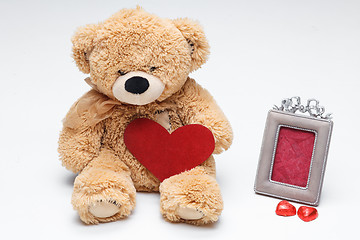 Image showing Teddy Bears couple with red heart. Valentines Day concept.