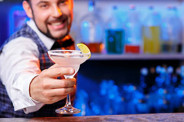 Image showing Barman at work, preparing cocktails.