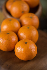 Image showing tangerines on wooden background