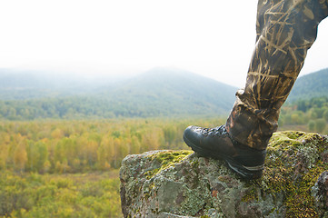 Image showing Tourist at sunrise in mountain