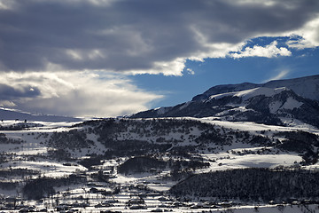 Image showing Winter mountains and village at evening