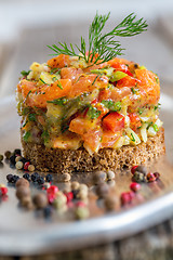 Image showing Tartare with salmon, green onions and capers.