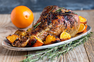 Image showing Thigh of turkey baked with oranges.