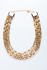 Image showing metal feminine necklace. 