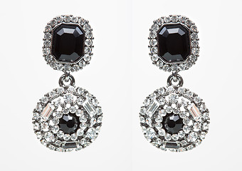 Image showing earrings with black stones on the white