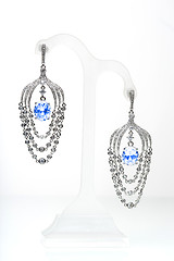 Image showing earrings with blue stones on the white