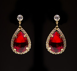 Image showing earring with colorful red gems 