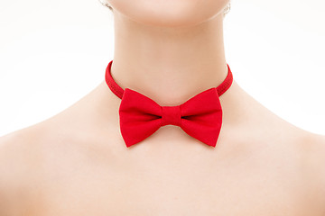 Image showing red tie bow on female neck. 