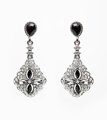 Image showing earrings with black stones on the white