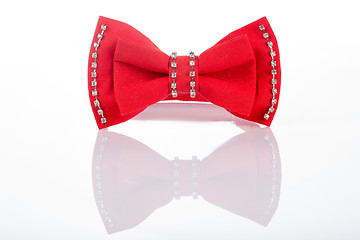 Image showing red bow tie with sequins on a white background