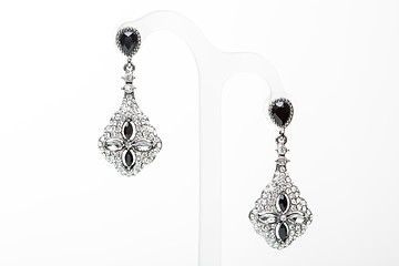 Image showing earrings with black stones on the white