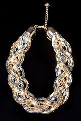 Image showing metal feminine necklace. 