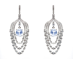 Image showing earrings with blue stones on the white