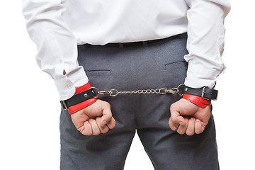 Image showing man with chained hands. handcuffs for sex games. isolated on white background