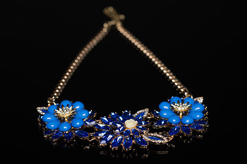 Image showing plastic blue necklace