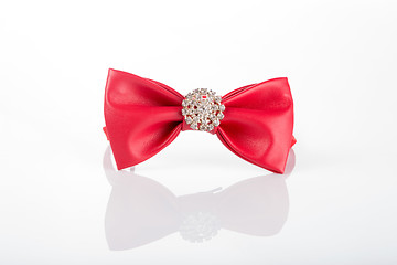 Image showing red bow tie with sequins on a white background