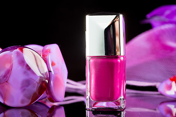 Image showing magenta nail polish on  background of women\'s accessories