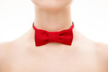 Image showing red tie bow on female neck. 