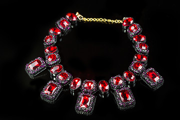 Image showing red plastic  necklace