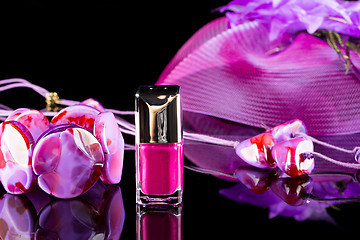 Image showing magenta nail polish on  background of women\'s accessories