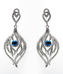 Image showing earrings with blue stones on the white