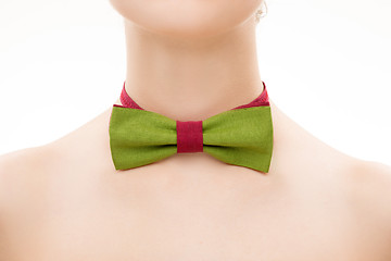 Image showing green tie bow on female neck. 