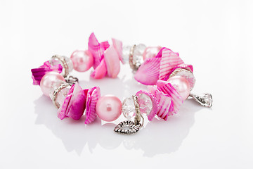 Image showing pink bracelet with pendants 