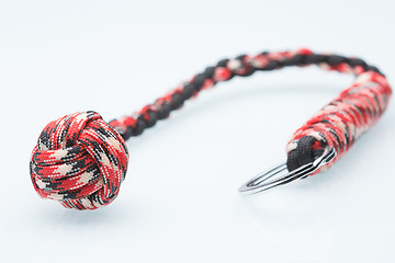 Image showing braided laces keychain. bludgeon for self-defense. white background