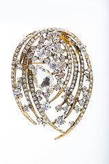 Image showing Round golden brooch with diamonds 