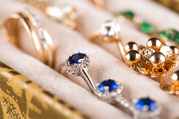 Image showing box with jewelery. Rings and pendants. 