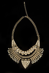 Image showing metal feminine necklace. on black  background. 