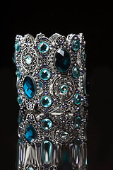 Image showing Bracelet with blue stones over black 