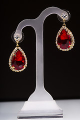 Image showing earring with colorful red gems 