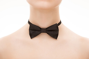 Image showing black tie bow on female neck. 