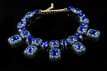 Image showing plastic blue necklace