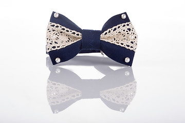 Image showing blue bow tie with white lace