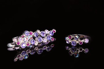 Image showing earring and ring with colorful gems 