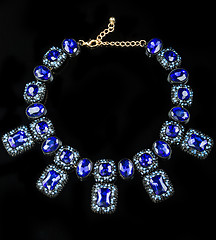 Image showing plastic blue necklace