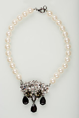 Image showing pearl necklace with black stones on a white 