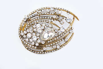 Image showing Round golden brooch with diamonds 